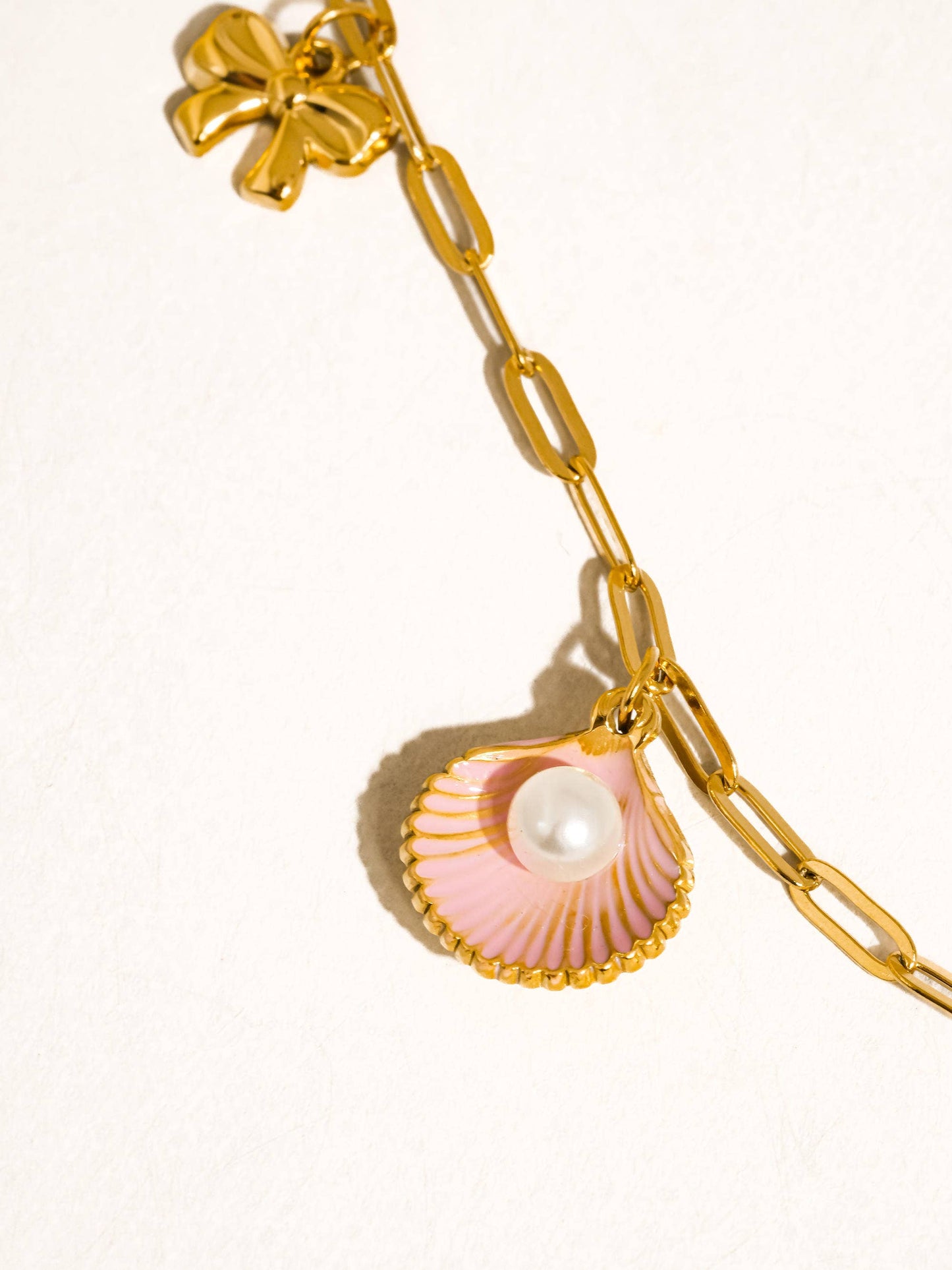 Tyla Bow Charm Necklace: Yellow Gold