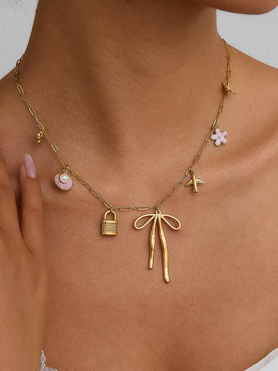 Tyla Bow Charm Necklace: Yellow Gold